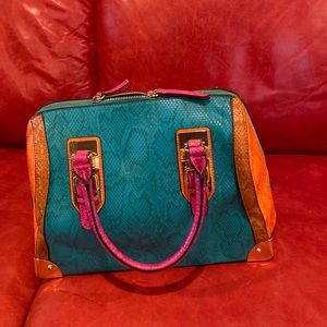 Also multi colored snake pattern purse